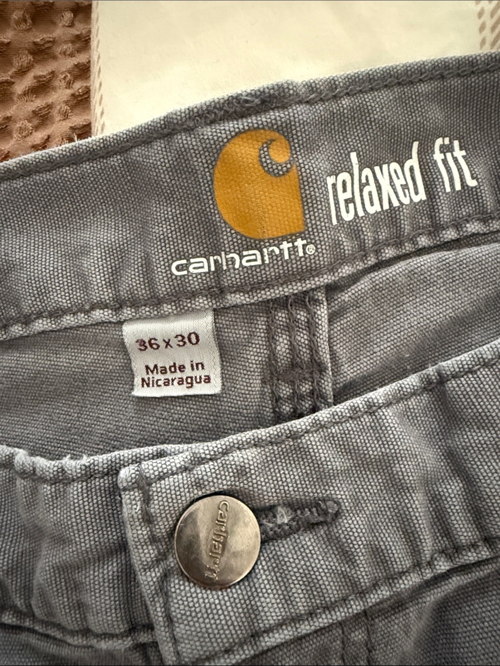 Carhartt Men’s Relaxed Fit Gray Jeans with Yellow Logo Accent